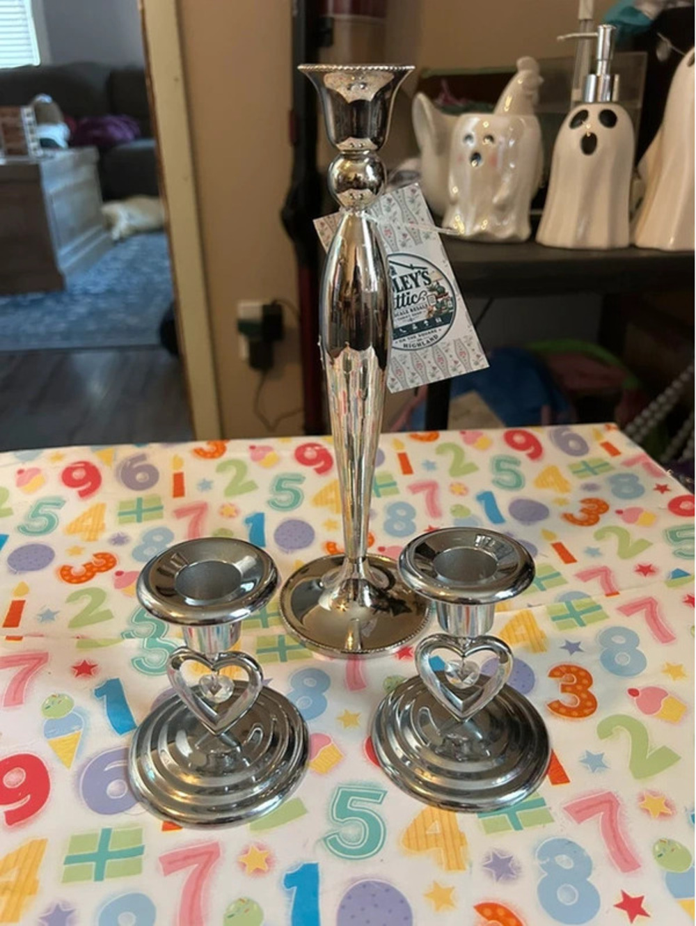 Set of 3 silver toned metal candle sticks